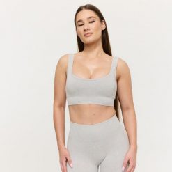 Biustonosz damski sportowy bezszwowy szary Lift. Szare biustonosze sportowe damskie GYMBEAM, bez wzorów, z elastanu. Za 69.99 zł.