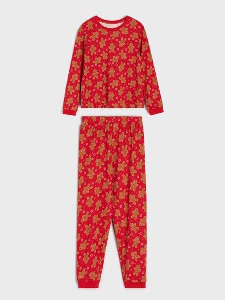 Świąteczna piżama dwuczęściowa z motywem pierniczków - czerwony. Czerwone piżamy damskie Sinsay, l, bez wzorów, bez ramiączek. W wyprzedaży za 19.99 zł.