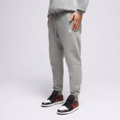 Męskie spodnie sportowe Air Jordan Essentials Fleece Pants FJ7779-091. Szare spodnie dresowe męskie Jordan, bez wzorów, z dresówki. Za 263.35 zł.