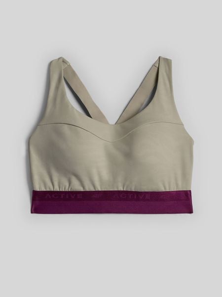 4F Biustonosz treningowy ze średnim wsparciem damski - beżowy M. Brązowe biustonosze sportowe damskie 4f, bez wzorów, z gumy. Za 149.99 zł.