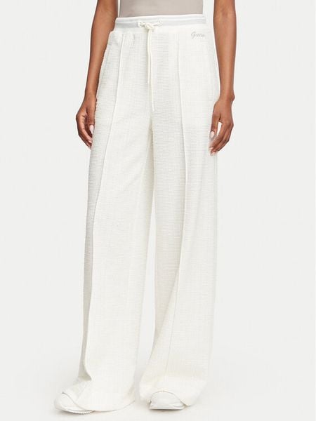 Guess Spodnie materiałowe W6YB13 K4363 Kremowy Relaxed Fit. Białe spodnie materiałowe damskie Guess, z aplikacjami, z bawełny. Za 434.99 zł.