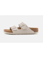 Birkenstock Skórzane klapki "Arizona" w kolorze kremowym rozmiar: 38. Brązowe klapki damskie Birkenstock, bez wzorów, ze skóry, bez obcasa. Za 434.85 zł.
