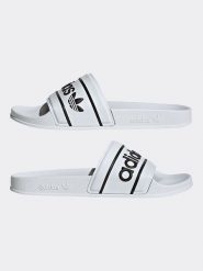 Adidas Klapki w kolorze białym rozmiar: 43. Białe klapki damskie Adidas, bez wzorów, bez obcasa. Za 158.10 zł.