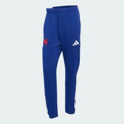 Spodnie Francja Rugby Travel. Niebieskie spodnie sportowe męskie Adidas, z bawełny. Za 369.00 zł.