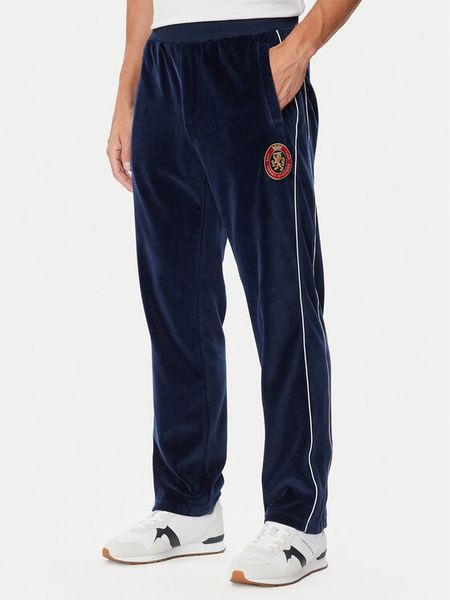 Tommy Hilfiger Spodnie dresowe Gift Crest MW0MW45207 Granatowy Regular Fit. Niebieskie spodnie dresowe męskie Tommy Hilfiger, bez wzorów, z bawełny. Za 649.99 zł.