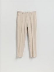 Garniturowe spodnie slim fit - beżowy. Brązowe spodnie wizytowe męskie Reserved, z tkaniny. Za 169.99 zł.