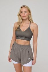 Biustonosz sportowy Infinite ze średnim wsparciem - khaki. Zielone biustonosze sportowe damskie OOSC, bez wzorów, z materiału. Za 147.99 zł.