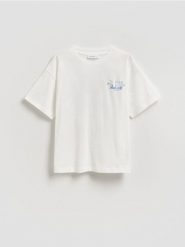 T-shirt z nadrukiem na plecach - złamana biel. Koszulki dziewczęce Reserved, bez wzorów, z bawełny, bez ramiączek. Za 39.99 zł.