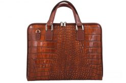 Torba na laptopa skórzana BARBERINI'S 118/1-6 brązowa. Brązowe torby na laptopa damskie Barberinis, bez wzorów, ze skóry, z tłoczeniem. Za 359.99 zł.