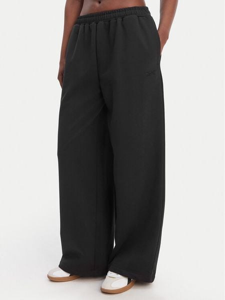 Reebok Spodnie dresowe Reebok x Ewa Chodakowska RK25624CCW Czarny Wide Leg. Czarne spodnie dresowe damskie Reebok, xs, bez wzorów, z dresówki. Za 199.99 zł.