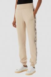 GUESS Beżowe damskie spodnie dresowe z lampasami Britney Jogger, Rozmiar S. Brązowe spodnie sportowe damskie Guess, s, z dresówki. Za 489.99 zł.