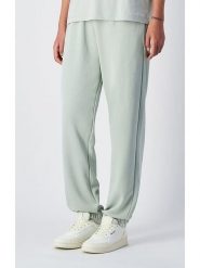 Champion Spodnie dresowe w kolorze miętowym rozmiar: M. Zielone spodnie dresowe damskie CHAMPION, m, bez wzorów, z dresówki. Za 125.45 zł.