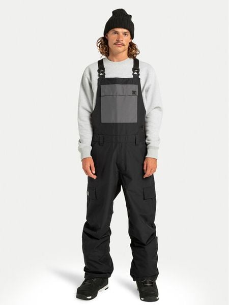 DC Shoes Spodnie snowboardowe Docile Bib ADYTP03052 Czarny Regular Fit. Czarne spodnie materiałowe męskie DC Shoes, bez wzorów, z syntetyku, sportowe. Za 589.99 zł.