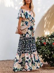 Milan Kiss Sukienka ze wzorem rozmiar: M. Niebieskie sukienki damskie Milan Kiss, na imprezę, m, bez wzorów, z tkaniny, bez kołnierzyka, bez ramiączek, maxi. Za 201.08 zł.