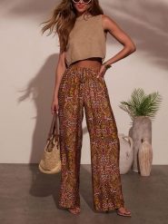 Milan Kiss Spodnie ze wzorem rozmiar: XL. Spodnie materiałowe damskie Milan Kiss, bez wzorów, z materiału. Za 126.99 zł.