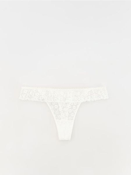 Majtki typu stringi - złamana biel. Stringi damskie Reserved, l, bez wzorów. Za 49.99 zł.