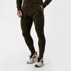 Spodnie męskie fitness slim zielone Urban. Zielone spodnie sportowe męskie GYMBEAM, z bawełny. Za 112.90 zł.