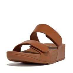 Skórzane sandały dla kobiet FitFlop Lulu Adjustable. Czarne sandały damskie FIT FLOP, bez wzorów, z materiału, bez obcasa. Za 483.50 zł.