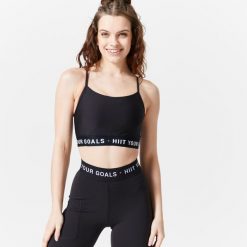 Stanik sportowy Decathlon. Fioletowe biustonosze sportowe damskie DOMYOS, bez wzorów, z elastanu. Za 49.99 zł.