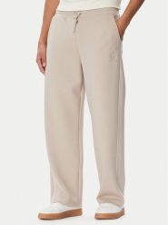 Guess Spodnie dresowe Z6BB01 K6526 Beżowy Regular Fit. Brązowe spodnie dresowe męskie Guess, z aplikacjami, z dresówki. Za 434.99 zł.