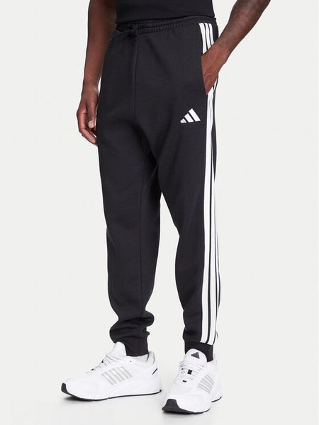 Adidas Spodnie dresowe Essentials 3-Stripes JD1861 Czarny Regular Fit. Czarne spodnie dresowe męskie Adidas, bez wzorów, z bawełny. Za 169.99 zł.