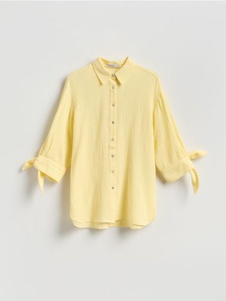 Muślinowa koszula - jasnożółty. Żółte koszule damskie Reserved, l, bez wzorów, z bawełny, bez kołnierzyka, bez ramiączek. Za 109.99 zł.