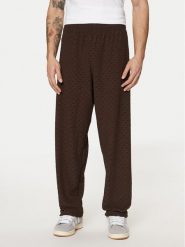 Adidas Spodnie dresowe Monogram Track JP4428 Brązowy Regular Fit. Brązowe spodnie dresowe męskie Adidas, bez wzorów, z dresówki. Za 199.99 zł.