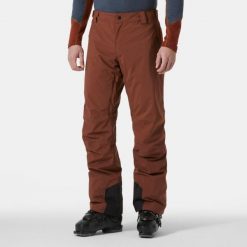 Spodnie narciarskie Helly Hansen Legendary. Brązowe spodnie materiałowe męskie Helly Hansen, bez wzorów, sportowe. W wyprzedaży za 668.50 zł.