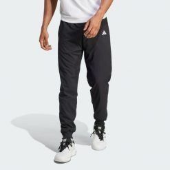 Spodnie tenisowe Walk-On. Czarne spodnie materiałowe męskie Adidas, bez wzorów, sportowe. Za 329.00 zł.