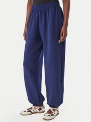 Adidas Spodnie dresowe Soft Lux KS7879 Niebieski Loose Fit. Niebieskie spodnie dresowe damskie Adidas, xs, bez wzorów, z dresówki. Za 329.99 zł.
