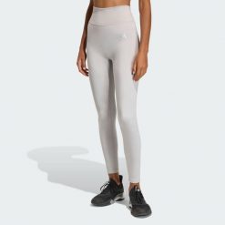 Legginsy Optime Essentials Workout Shine 7/8. Szare legginsy sportowe damskie Adidas, bez wzorów, z podwyższonym stanem, na fitness i siłownię. Za 219.00 zł.