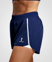 Spodenki do Tenis/Padel damskie Training. Niebieskie szorty damskie NORDICDOTS, bez wzorów, z materiału, klasyczne, z standardowym stanem. Za 190.00 zł.
