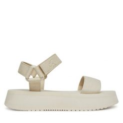 Sandały Calvin Klein Jeans. Sandały damskie Calvin Klein Jeans, bez wzorów, z jeansu, bez obcasa, na koturnie. Za 229.99 zł.