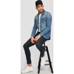 Tommy Jeans - Koszula jeansowa. Niebieskie koszule męskie Tommy Jeans, l, bez wzorów, z bawełny, bez kołnierzyka, bez ramiączek. Za 299.90 zł.