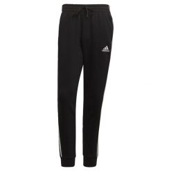 Spodnie męskie adidas Essentials Tapered Cuff 3 Stripes. Czarne spodnie sportowe męskie Adidas, z polaru. Za 182.00 zł.