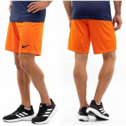 Pomarańczowe spodenki męskie Nike. Brązowe szorty męskie Nike, bez wzorów, z poliesteru. Za 66.99 zł.