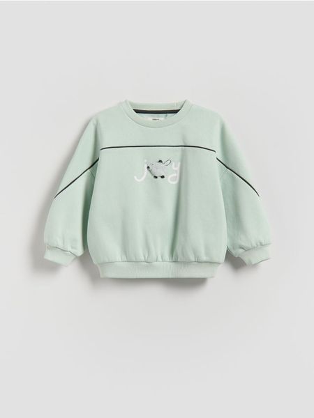 Bawełniana bluza - jasnozielony. Zielone bluzy i bluzki niemowlęce Reserved, bez wzorów, z bawełny, bez ramiączek, bez kaptura. Za 49.99 zł.