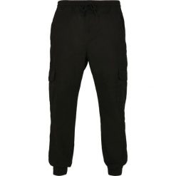 Spodnie Urban Classics military. Czarne spodnie materiałowe męskie Urban Classics, bez wzorów, z bawełny, militarne. Za 206.95 zł.