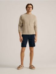 Szorty chino - granatowy. Niebieskie szorty męskie Sinsay, bez wzorów, z bawełny, eleganckie. Za 69.99 zł.