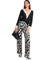 Heine Bluzka w kolorze czarnym rozmiar: 34. Czarne bluzki damskie Heine, bez wzorów, bez kołnierzyka, bez ramiączek. Za 43.99 zł.