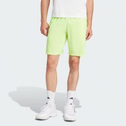Szorty Tennis Ergo. Żółte szorty męskie Adidas, bez wzorów, sportowe. Za 249.00 zł.