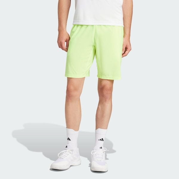 Szorty Tennis Ergo. Żółte szorty męskie Adidas, bez wzorów, sportowe. Za 231.90 zł.