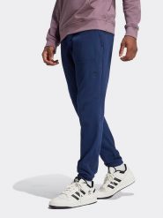 Adidas Spodnie dresowe w kolorze granatowym rozmiar: XL. Niebieskie spodnie dresowe męskie Adidas, bez wzorów, z bawełny. Za 136.13 zł.