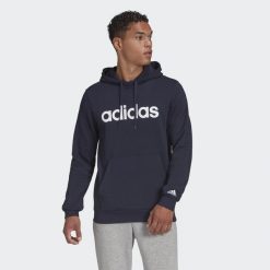 Bluza męska adidas Essentials Linear. Białe bluzy bez kaptura męskie Adidas, bez wzorów, sportowe, bez kołnierzyka, bez ramiączek. Za 164.00 zł.