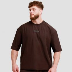 Koszulka męska fitness oversize Unstoppable. Brązowe t-shirty sportowe męskie GYMBEAM, m, z bawełny, bez ramiączek, na fitness i siłownię. Za 69.90 zł.