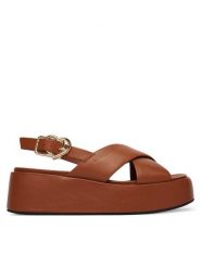 LOVE MOSCHINO Sandały JA16137I0OIA0200 Brązowy. Brązowe sandały damskie Love Moschino, bez wzorów, ze skóry, bez obcasa, na koturnie. Za 919.99 zł.