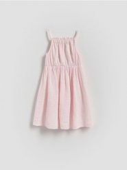 Sukienka z muślinowym dołem - pastelowy róż. Czerwone sukienki dziewczęce Reserved, bez wzorów, z bawełny, bez ramiączek. W wyprzedaży za 49.99 zł.