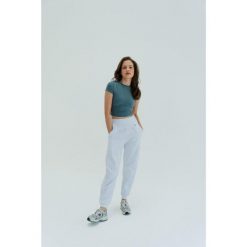 Koszulka treningowa do jogi Moonholi Timeless z krótkim rękawem. Szare bluzki sportowe damskie MOONHOLI, xl, bez wzorów, bez ramiączek. Za 259.00 zł.