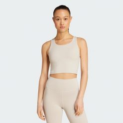Top z wbudowanym biustonoszem adidas All Me Medium Support. Czarne topy sportowe damskie Adidas, m, bez wzorów, z elastanu, bez ramiączek. Za 219.00 zł.
