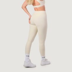 Legginsy damskie fitness z wysokim stanem NEO Almond. Brązowe legginsy damskie GYMBEAM, s, bez wzorów, z elastanu. Za 112.90 zł.